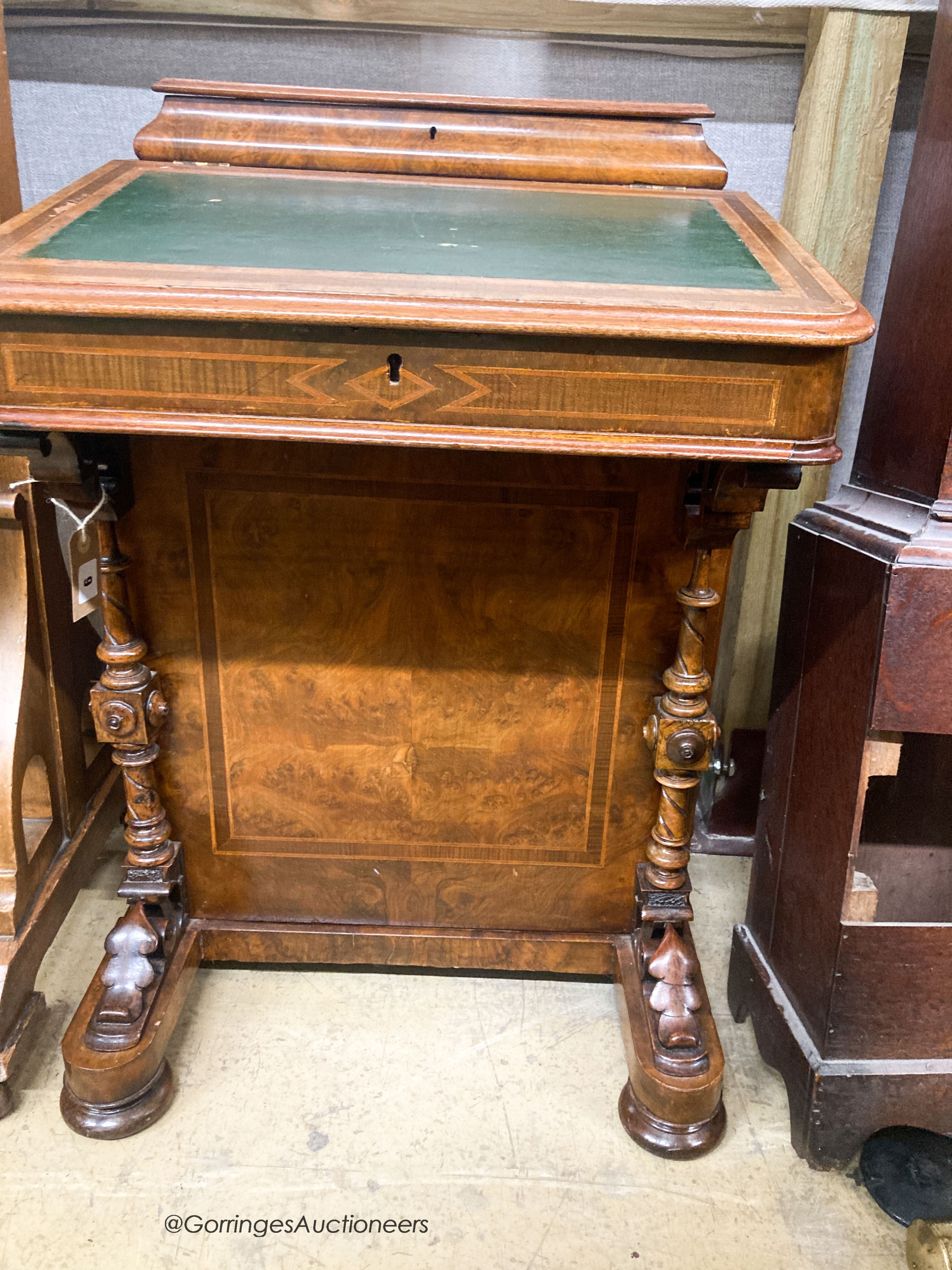 A Victorian banded walnut Davenport, W.54cm. D.54cm H.73cm